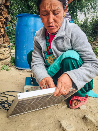 Nepal woman empower solar electricity remote rural